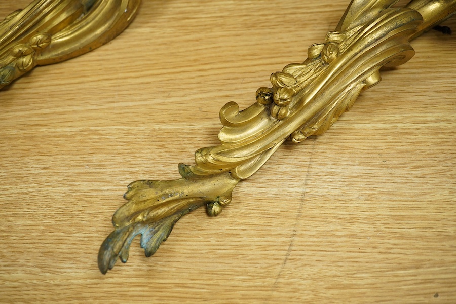 A pair of Rococo style ormolu wall lights, 74cm high. Condition - fair